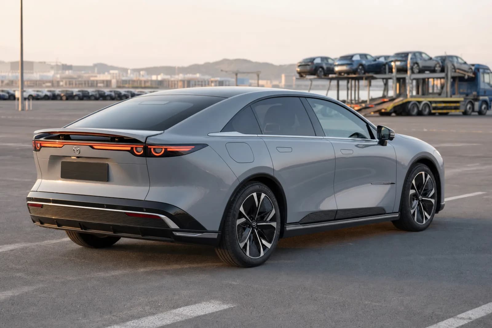 Mazda EZ-6 сзади на логистическом терминале